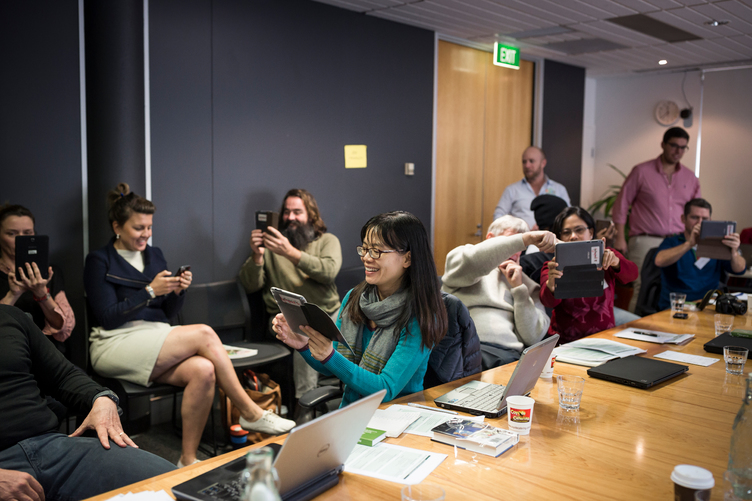 Researchers test taking photos for a mobile data collection application at the Canberra Masterclass in 2016