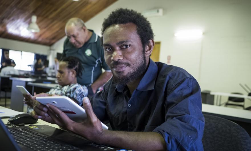 A researcher from the Food and Agriculture Organisation In Papua New Guinea tests his newly built CommCare application