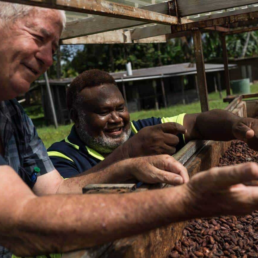 Albert Nongkas and Trevor Clarke inspect cocoa