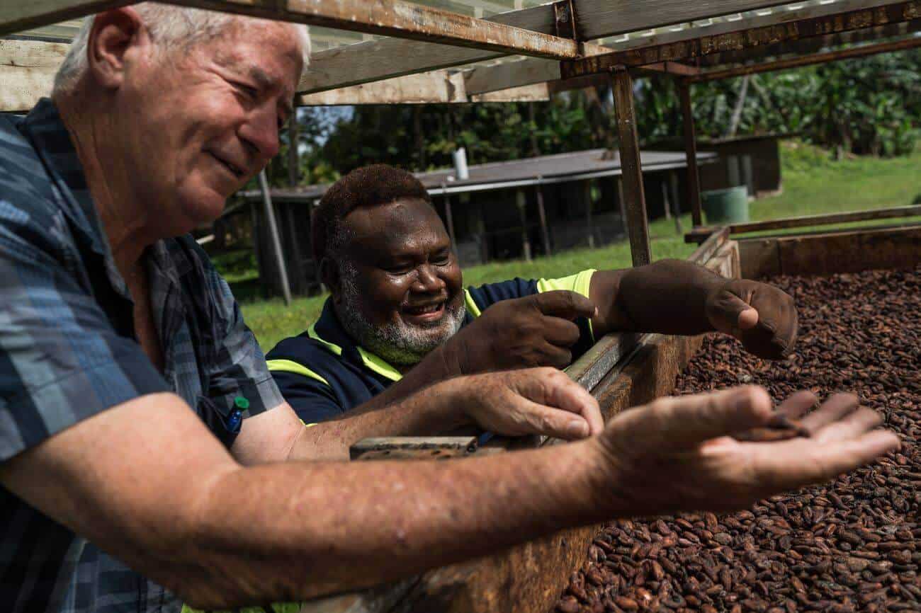 Albert Nongkas and Trevor Clarke inspect cocoa