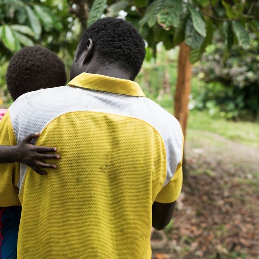 Cocoa farmer Roger Misimuko land his wife Mari carry their child